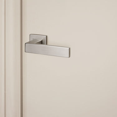 Imperio door handle stainless steel with square rosette