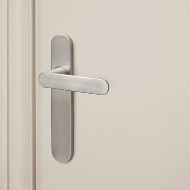 Novara door handle stainless steel with rounded shield