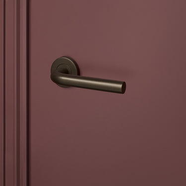 Oristano door handle bronze with round rosette