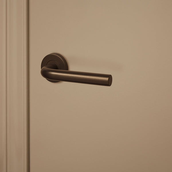 Oristano door handle bronze with round rosette