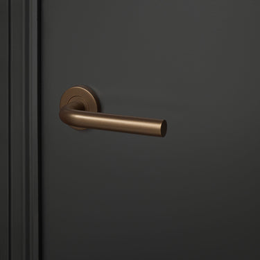 Oristano door handle bronze with round rosette
