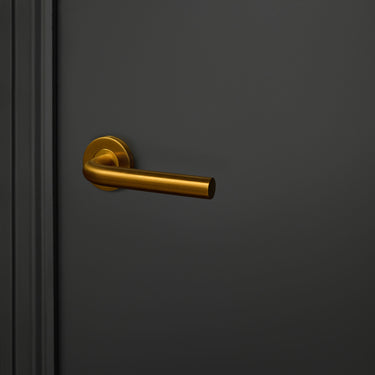 Oristano door handle matt gold PVD coated with round rosette