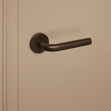 Oristano door handle bronze with round rosette