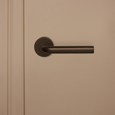 Oristano door handle bronze with round rosette