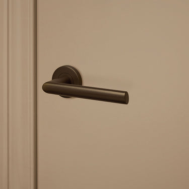 Ragusa door handle bronze with round rosette