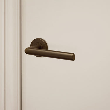 Ragusa door handle bronze with round rosette