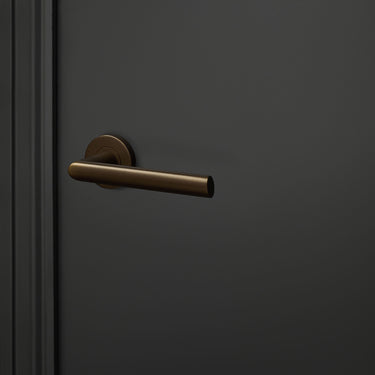 Ragusa door handle bronze with round rosette