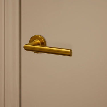 Ragusa door handle matt gold PVD coated with round rosette