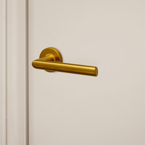Ragusa door handle matt gold PVD coated with round rosette